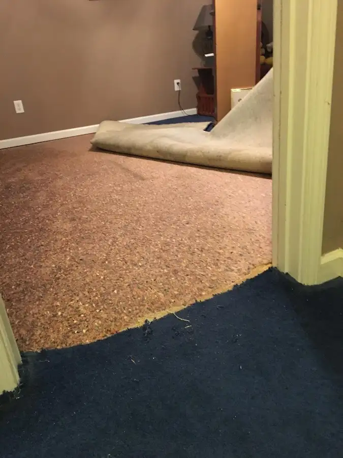 Carpet pad removal revealing water damage during Drying & Dehumidification in Salton City